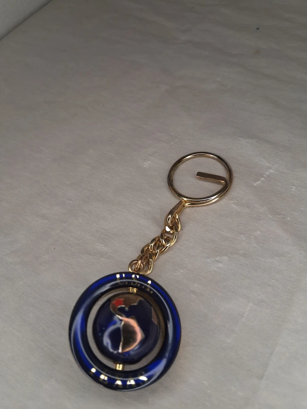 Gold Tone Keyring with Blue Enamel Round Charm